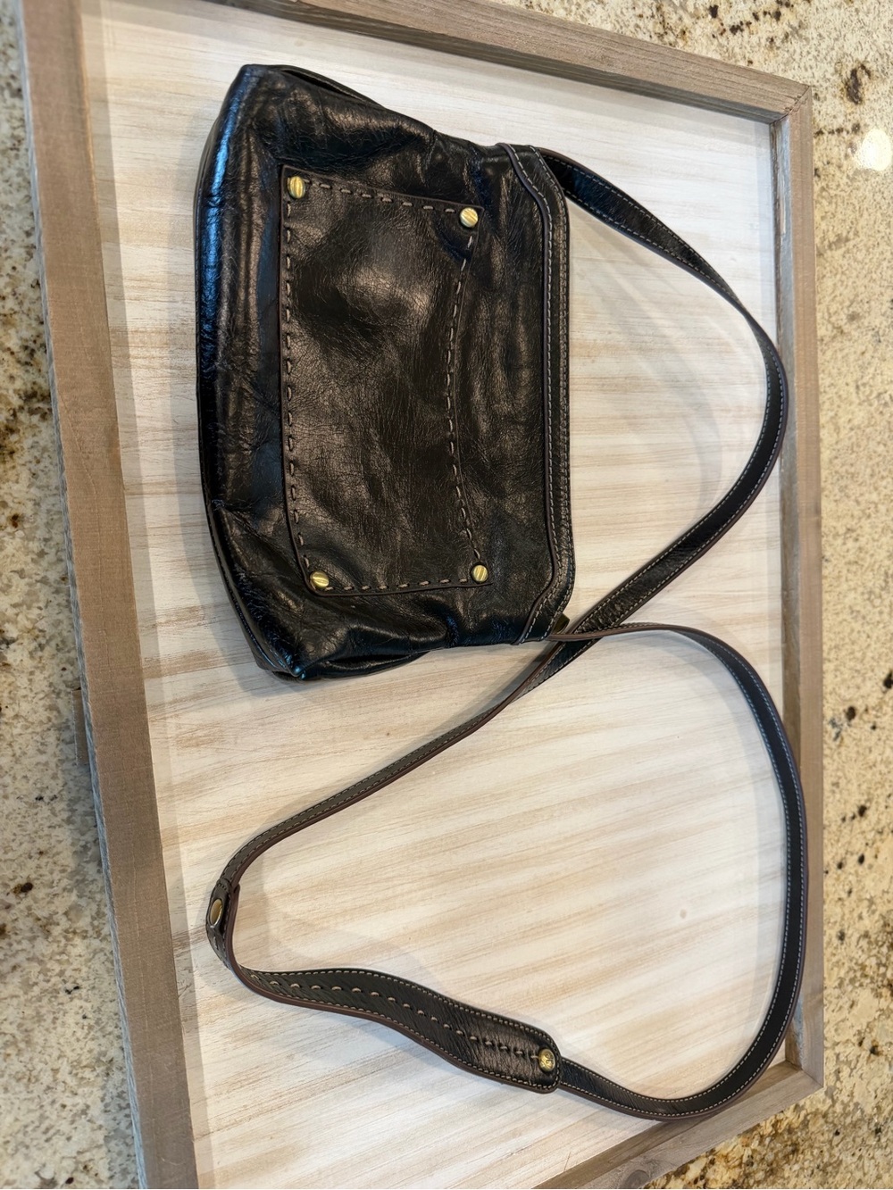 Classic Black Leather Shoulder Bag with Brass Accents